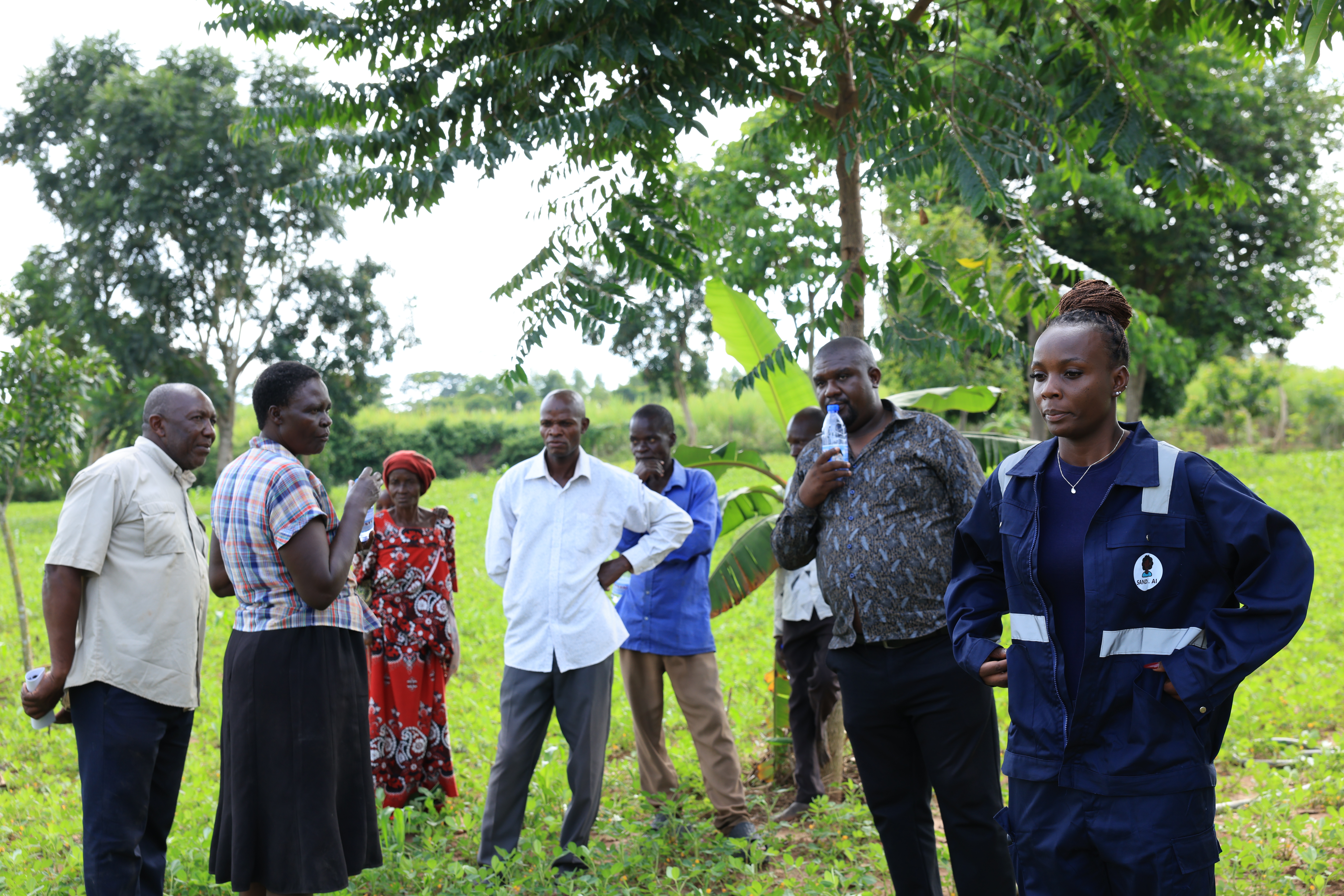 Farmers setting up a Sandi AI solar irrigation kit